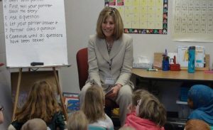 Sandi Novak goes over an anchor chart with students.