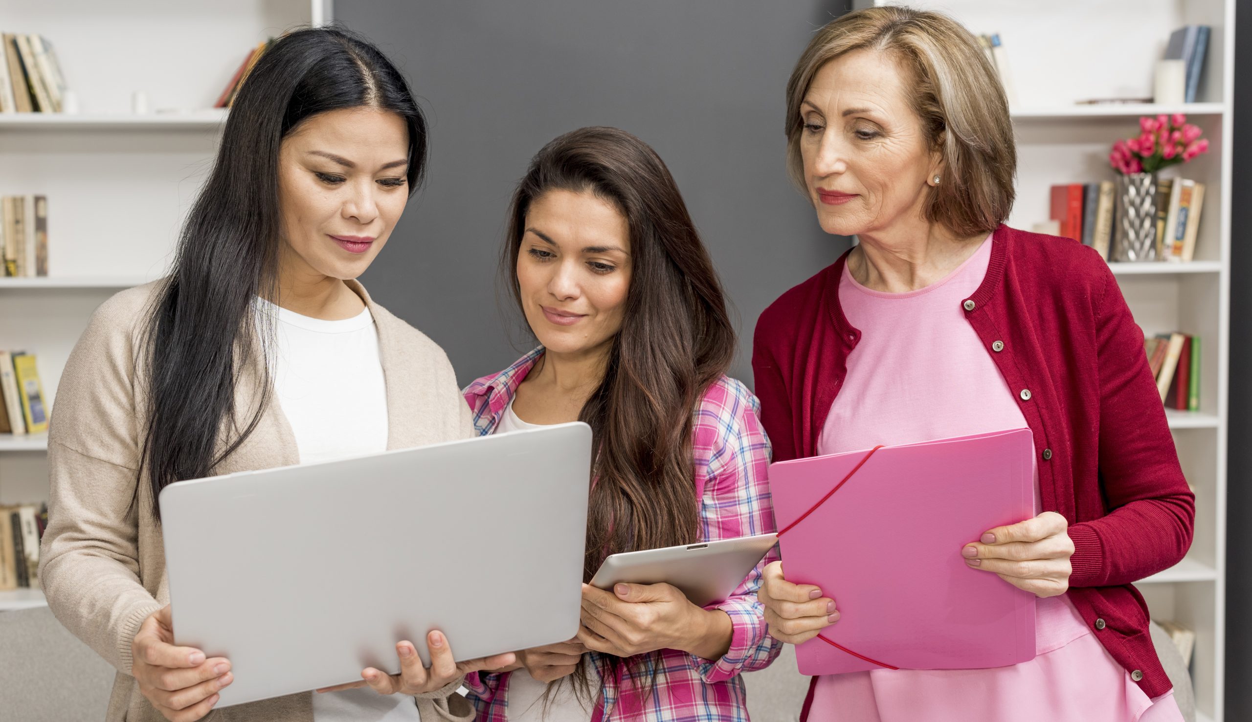 group-womens-looking-laptop
